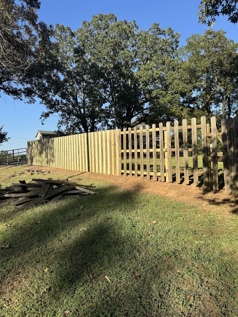 Davinci Home Improvements crew rebuilding a section of wood fence